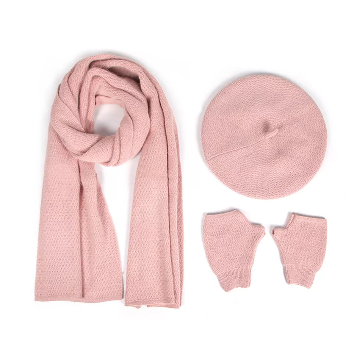 Pink knitted winter set arranged flat with long scarf, beret, and fingerless gloves