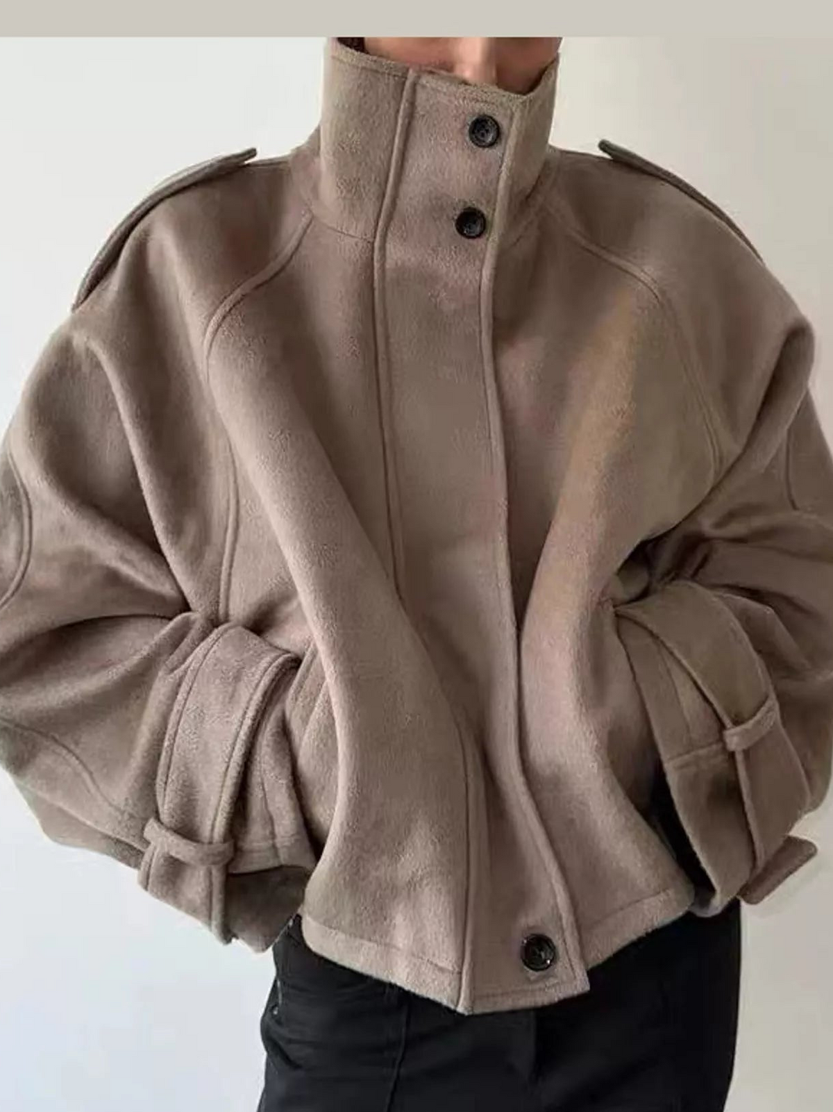 Beige stand-collar zip-up jacket with buttoned front and gathered cuff