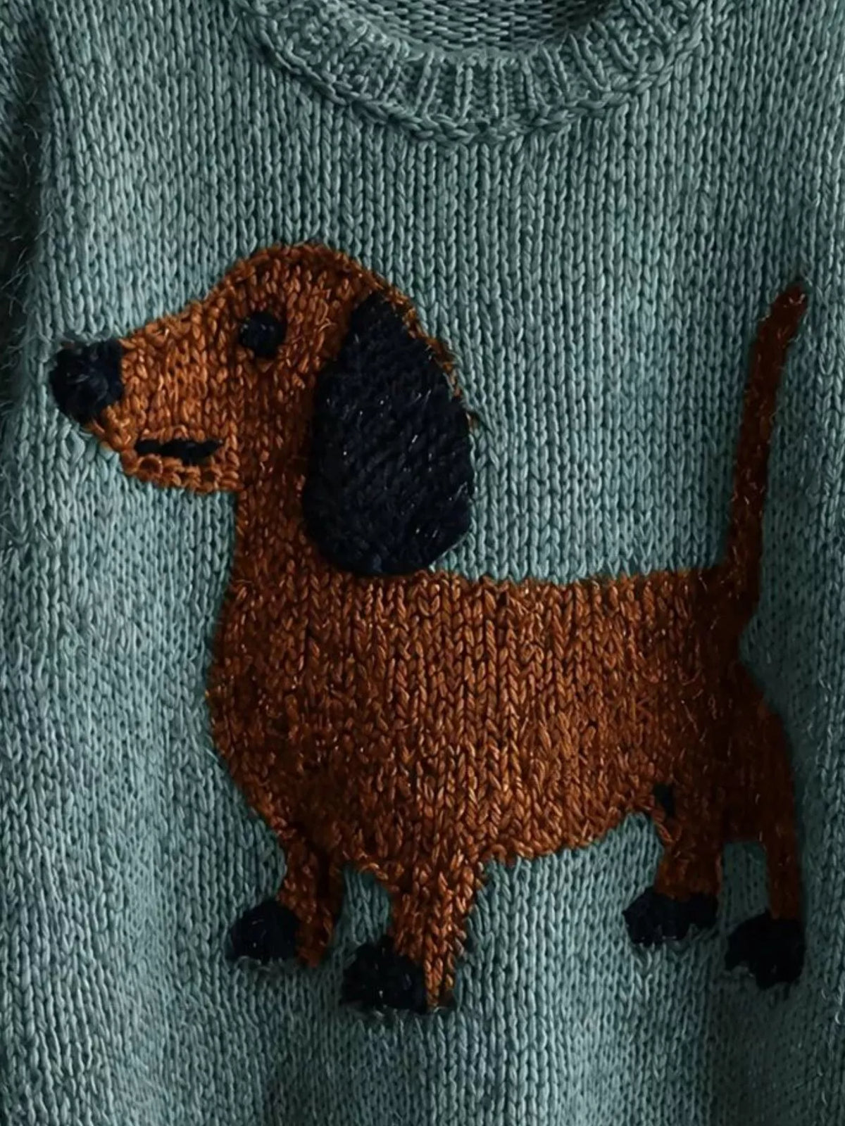 Teal dropped-shoulder knit sweater with dachshund intarsia front detail