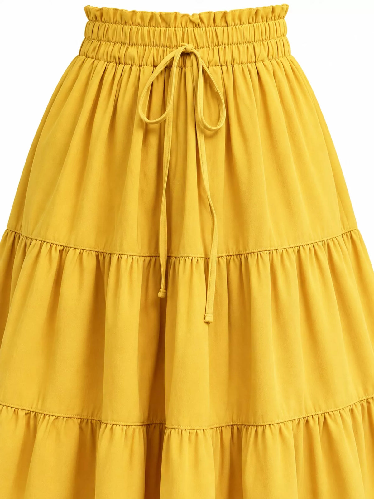 Close-up of yellow tiered midi skirt waist with elastic band and hanging drawstring ties.