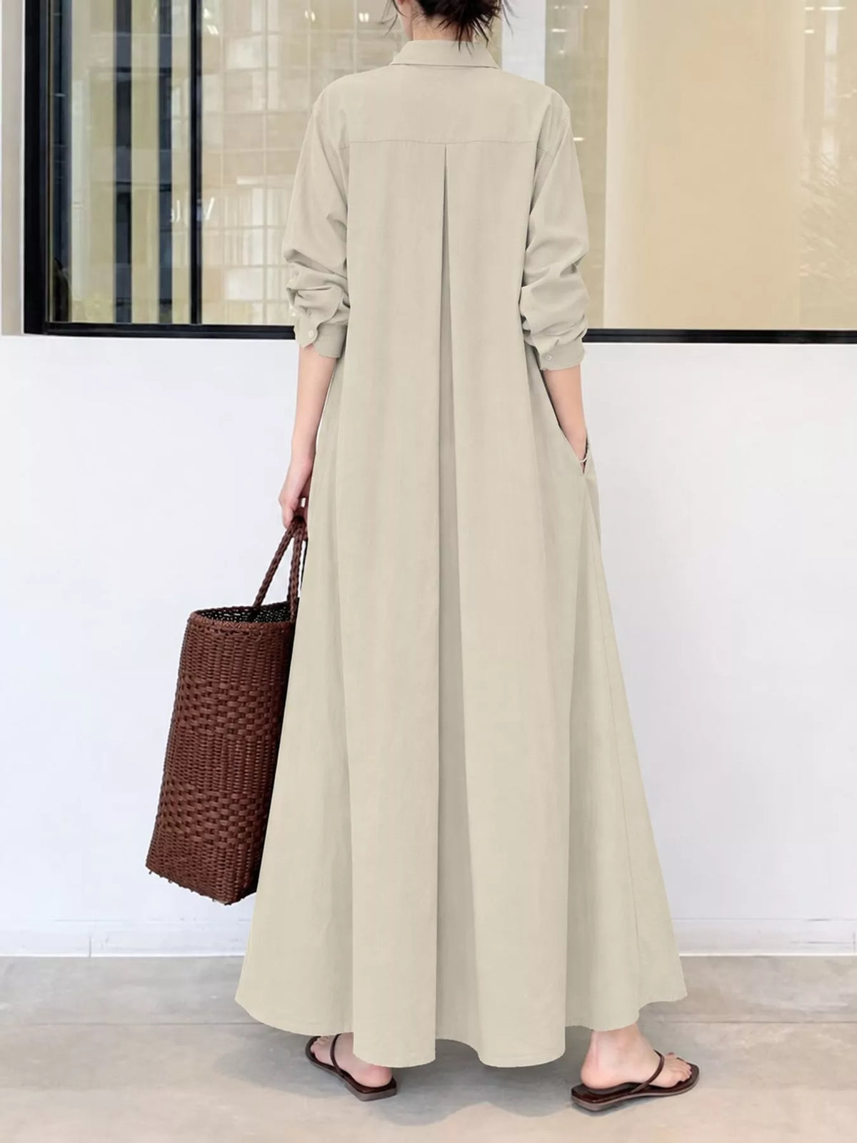 Light beige button-front long sleeve maxi shirt dress from back view