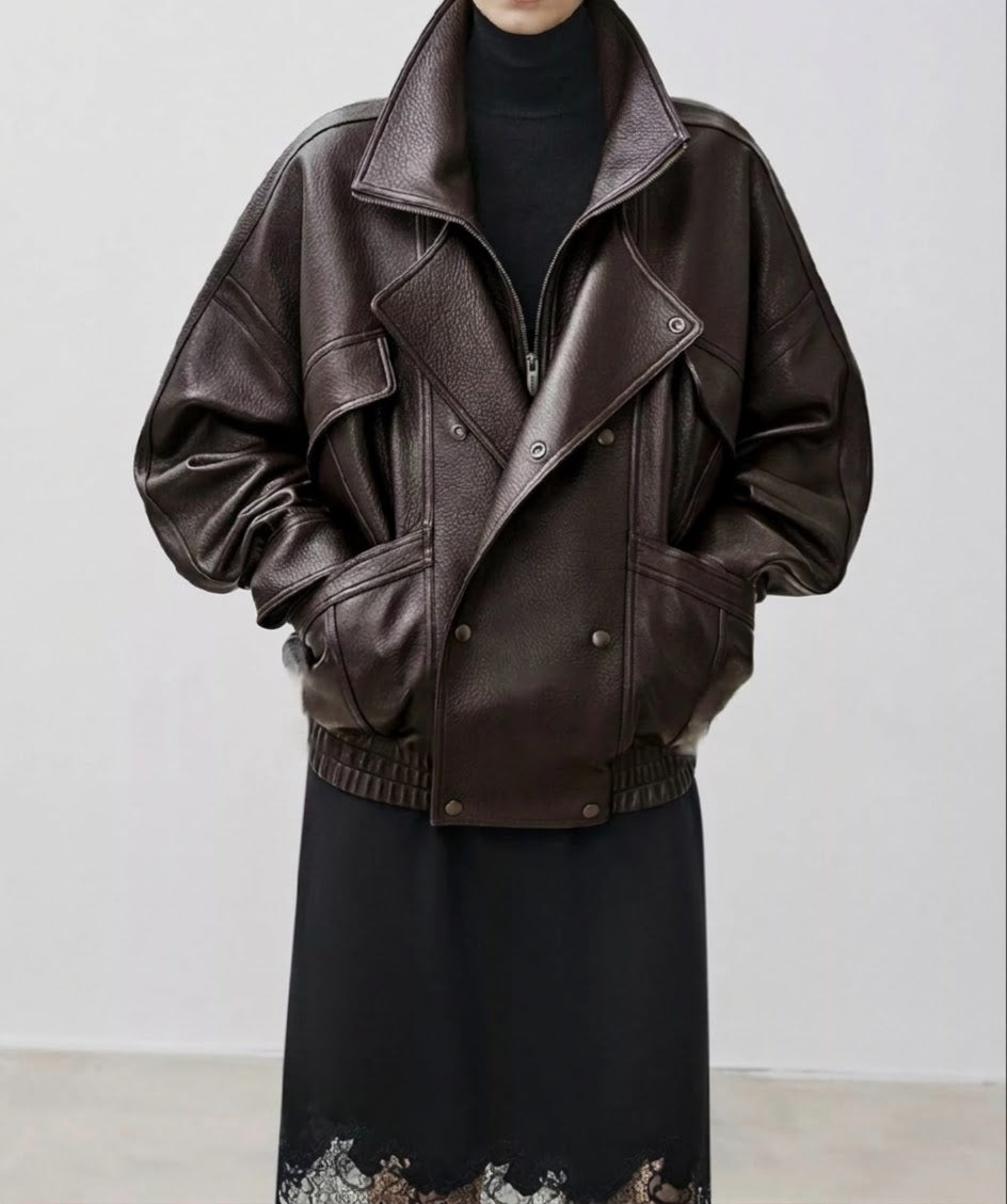 Dark brown leather down jacket with angled flap pockets and snap button front