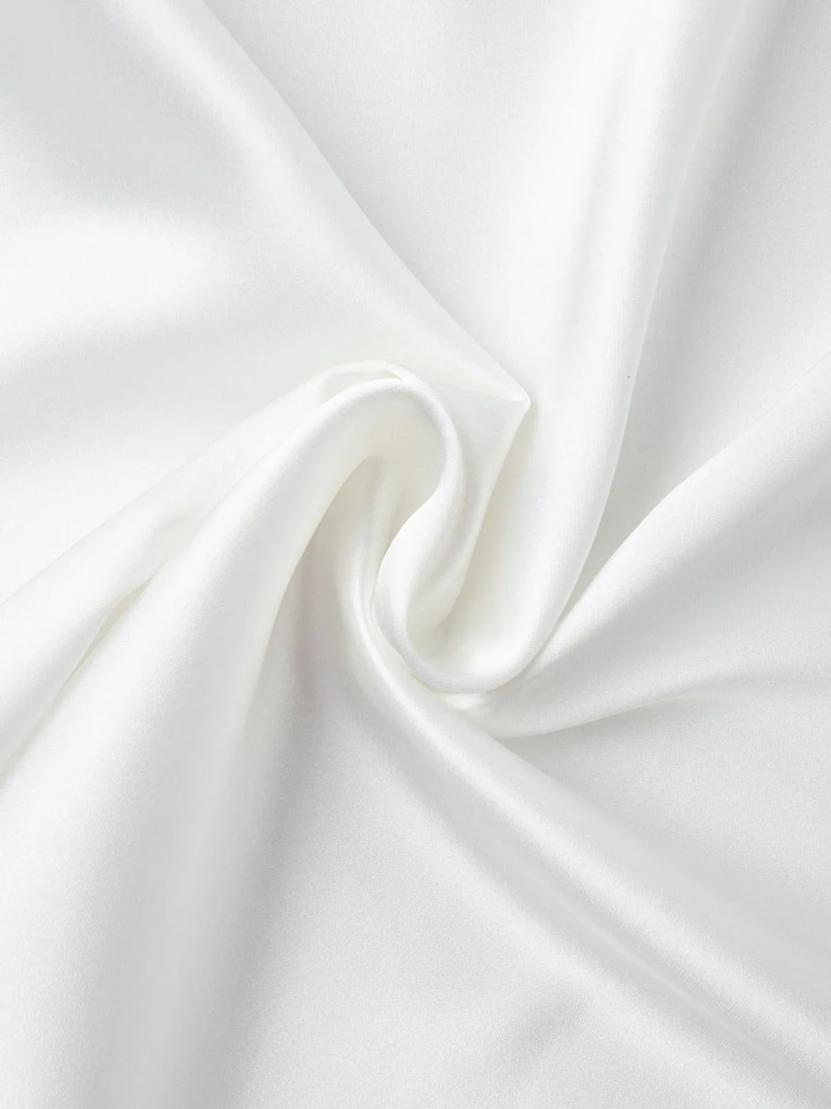 White high-waisted maxi skirt fabric close-up, silky drape with subtle sheen.