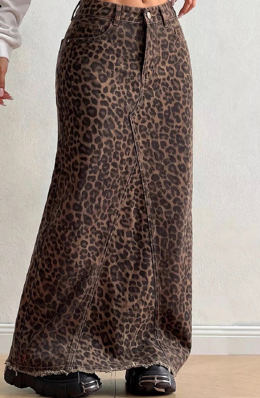 Leopard-print denim maxi skirt with button-front closure, front pockets, and frayed hem
