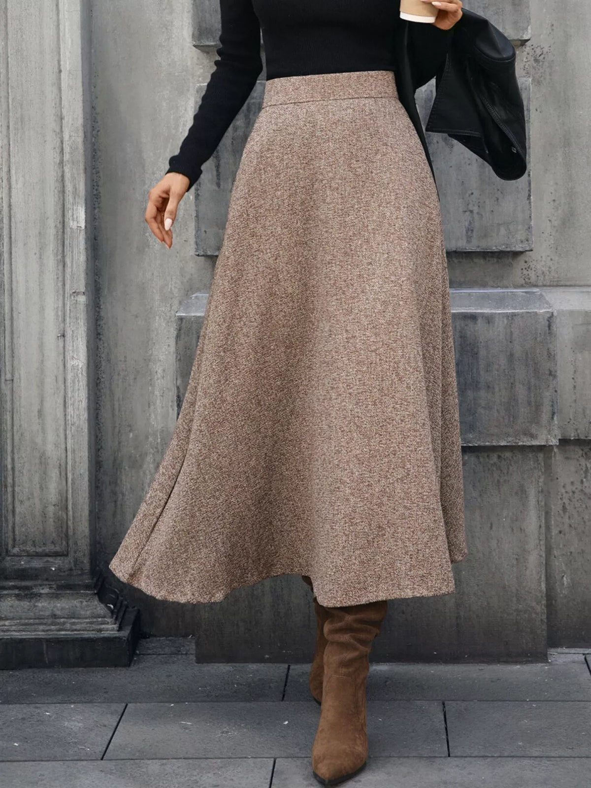Brown A-line midi skirt shown in motion, with a gently swinging hem