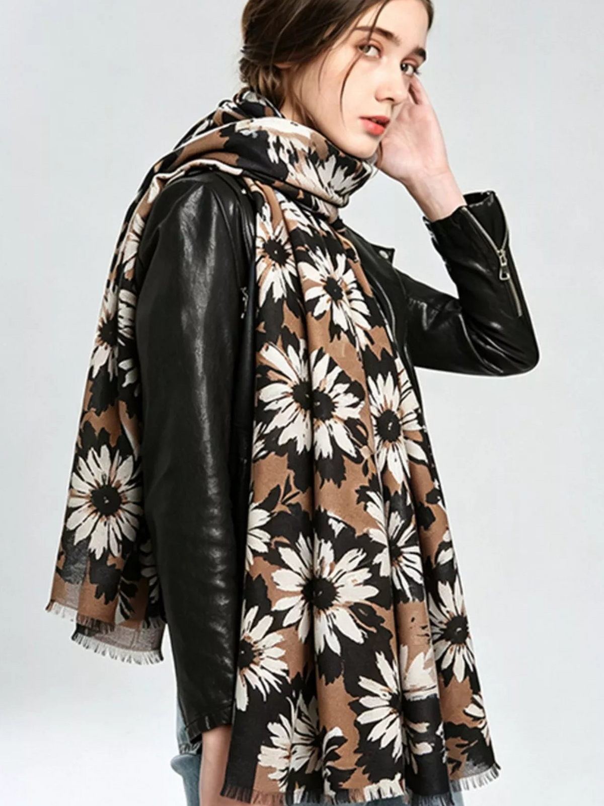 Floral print fashion scarf with dark background, tan and cream flowers, fringed edges