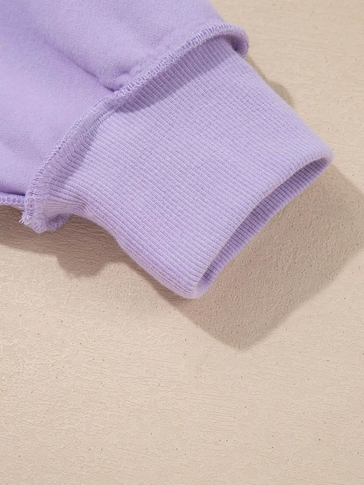 Lavender ribbed sleeve cuff with elastic hem detail