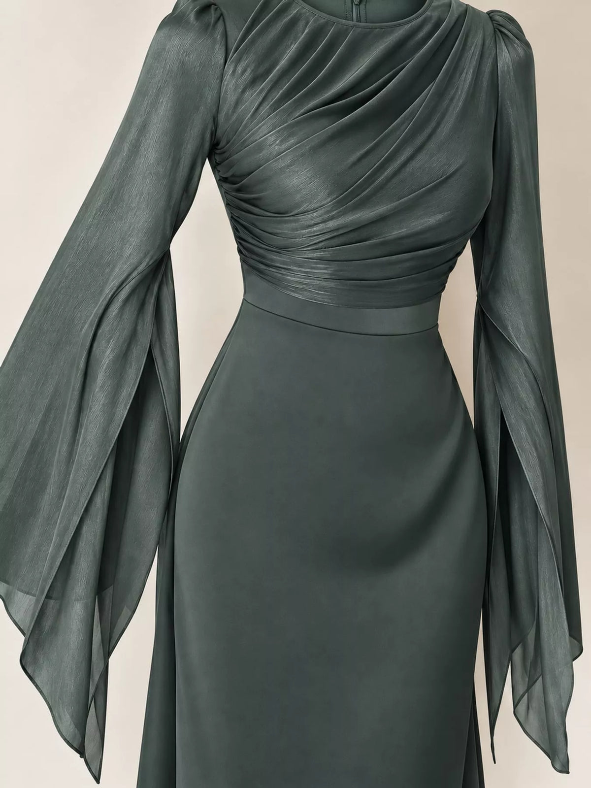 Dark gray maxi dress with a ruched bodice, fitted waist, and sheer flared sleeves
