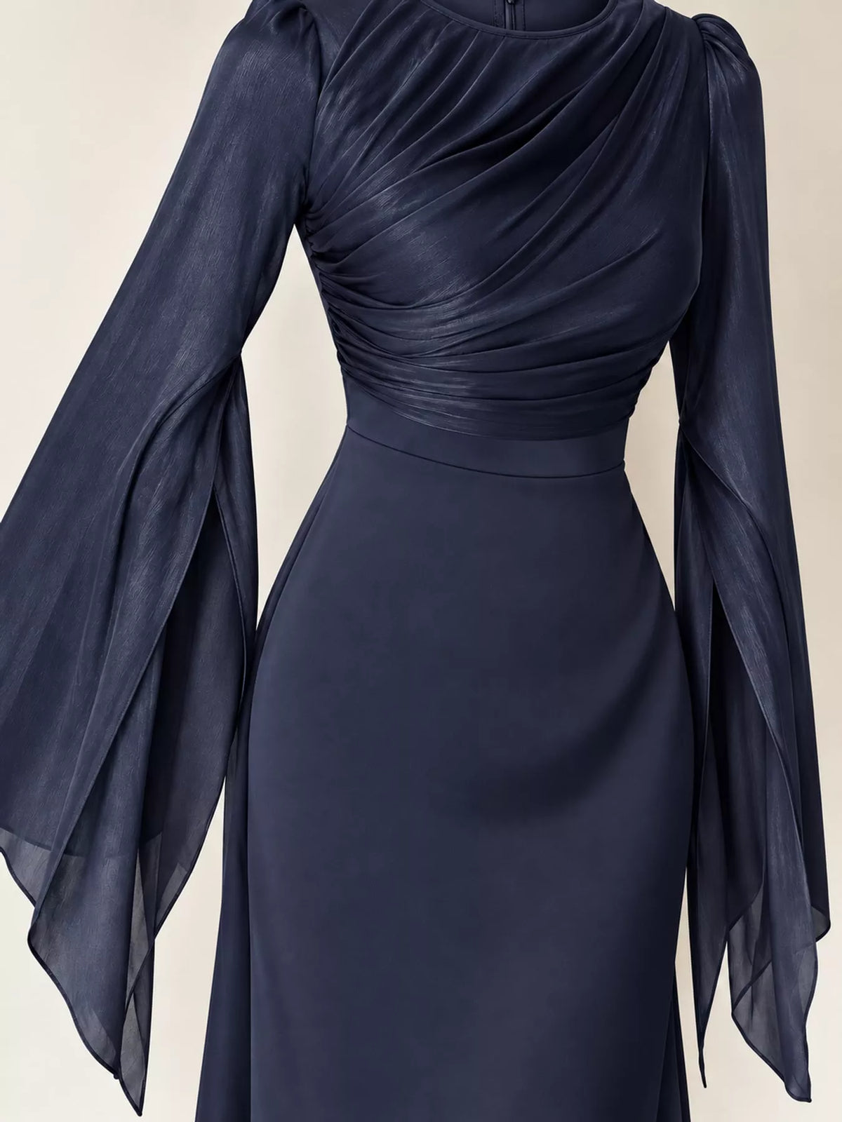 Dark blue maxi dress detail showing ruched bodice and sheer flared sleeves