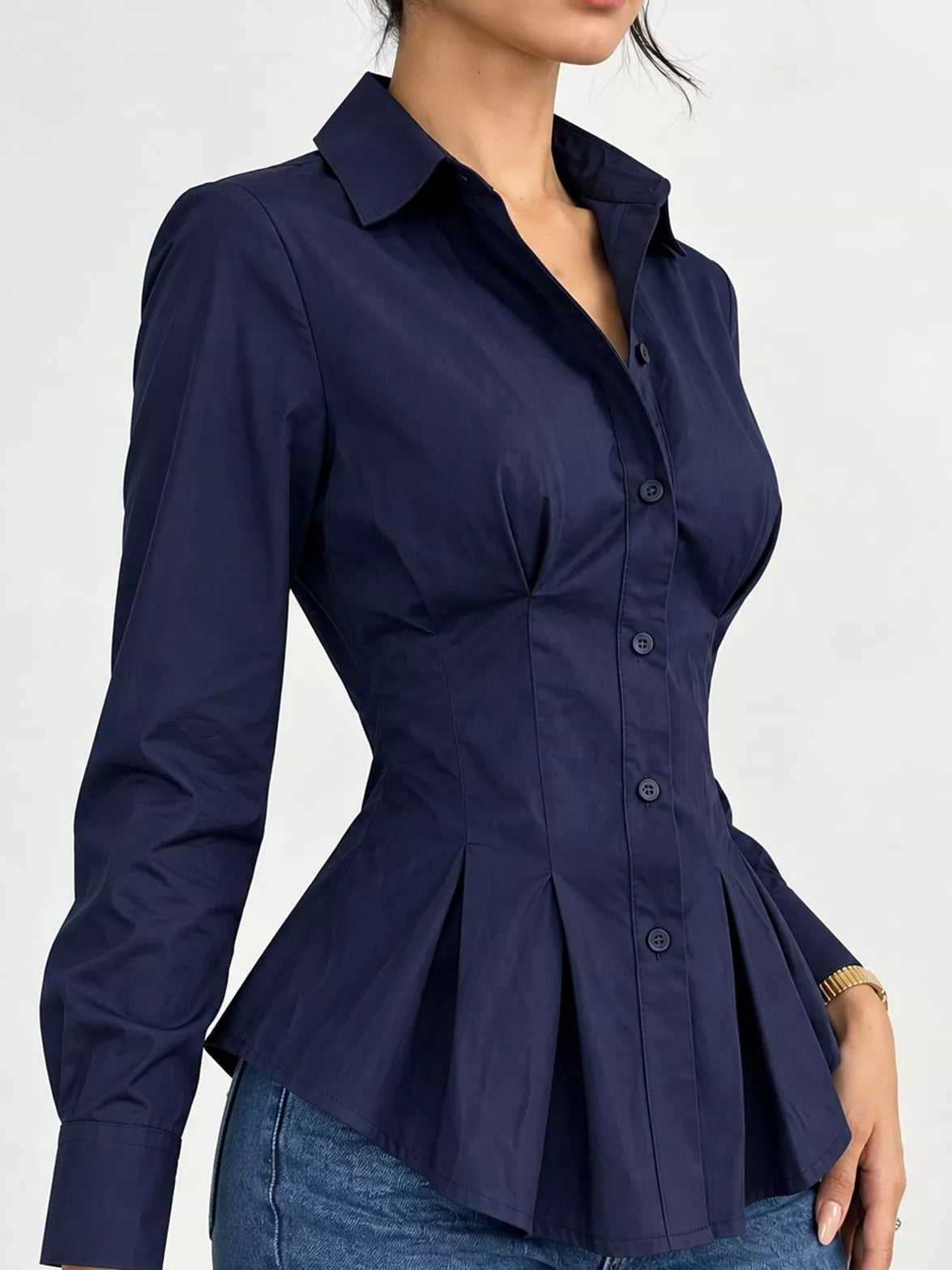 Navy button-down peplum blouse with fitted waist, long sleeves, peplum flare at hip