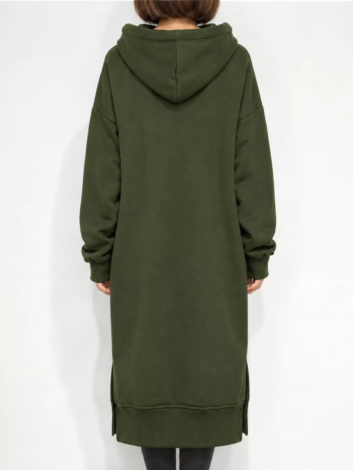 Back view of a green hooded sweatshirt dress with long sleeves and side slits