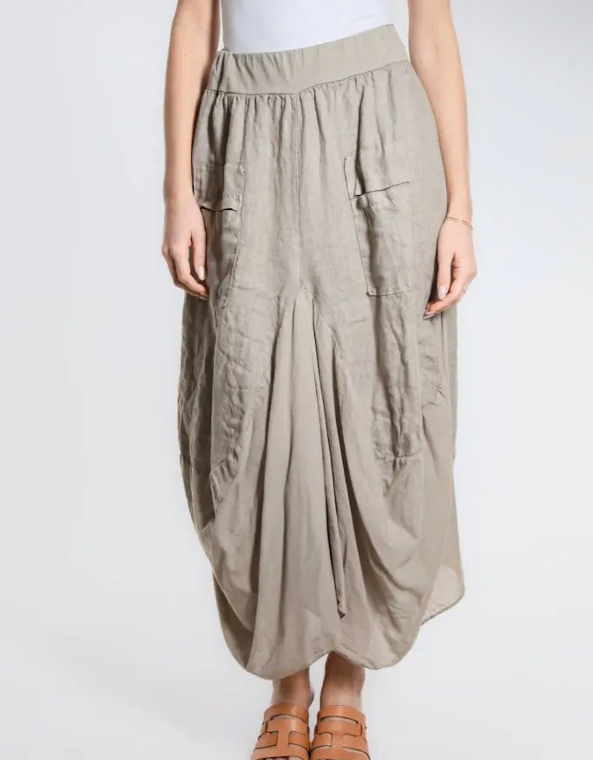 Taupe bunched pocket skirt with elastic waist, pleated drape and visible patch pockets
