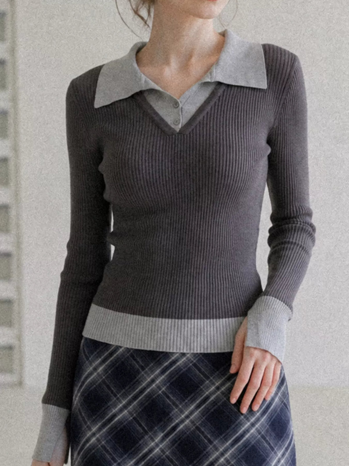 Charcoal ribbed knit top with contrast gray collar and button placket, shown from the front