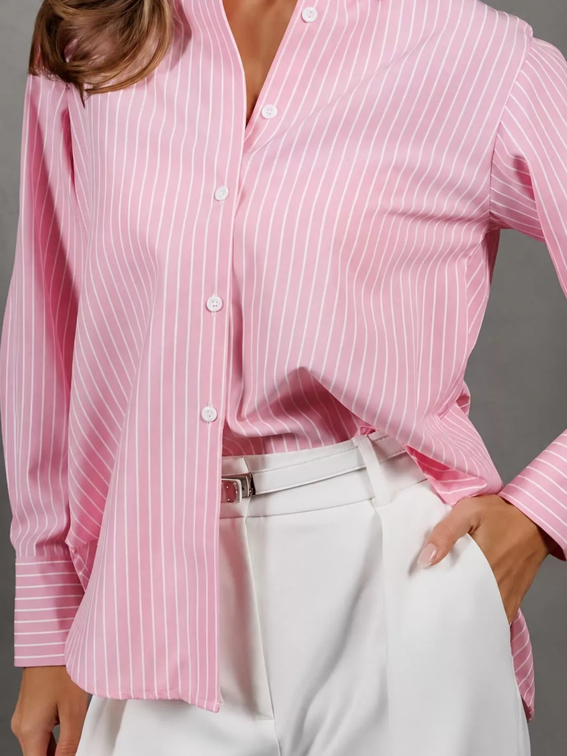 Pink striped button-up long sleeve shirt with pointed collar and front buttons