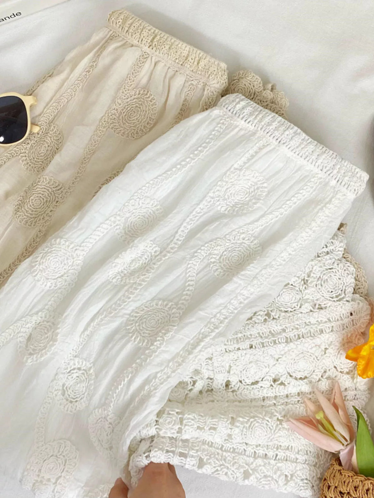 White and apricot lace skirts, showing the white skirt's layered crochet hem