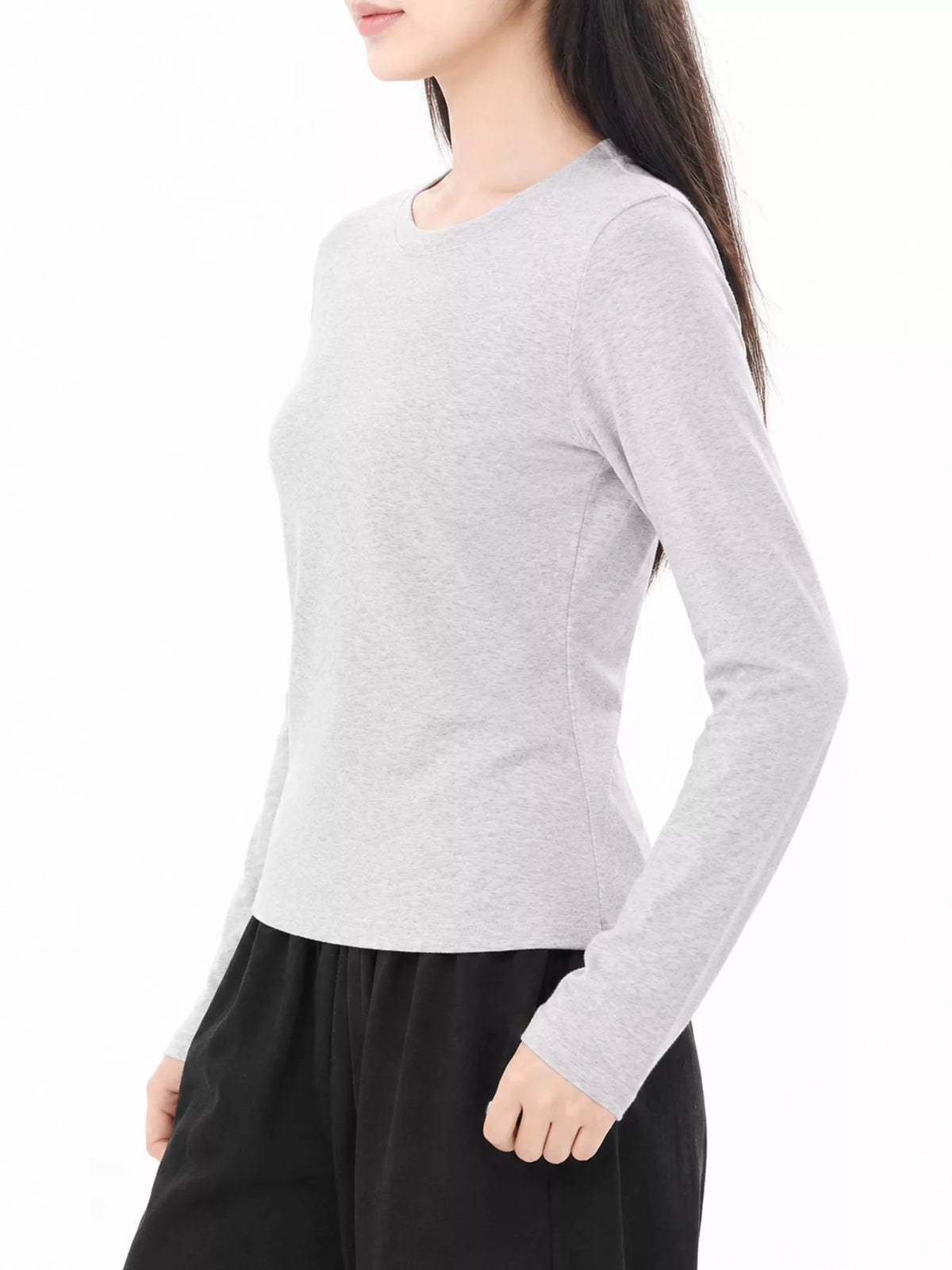 Light heather gray long sleeve crew neck T-shirt, side view with fitted sleeves.