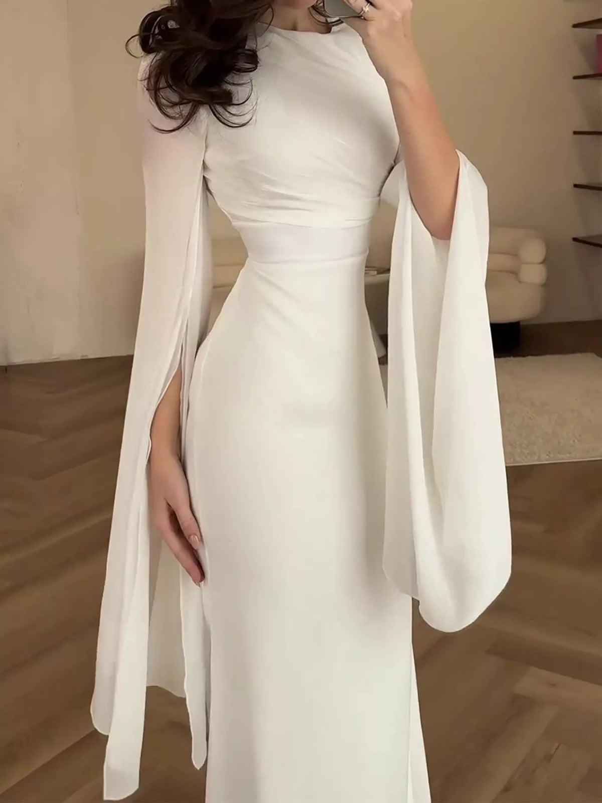 White round-neck maxi dress with a fitted waist and flowing split sleeves