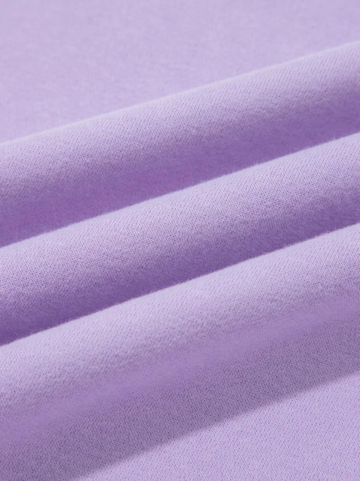 Lavender sweatshirt knit fabric close-up, smooth soft surface