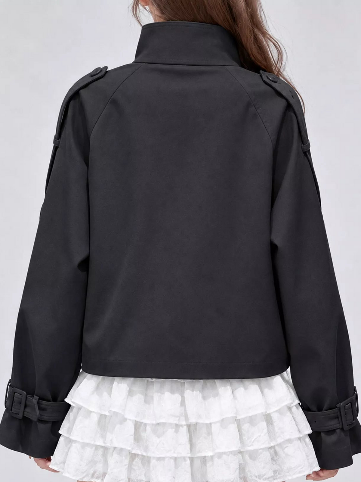 Black cropped trench jacket with stand collar and back yoke; belt strap at hem
