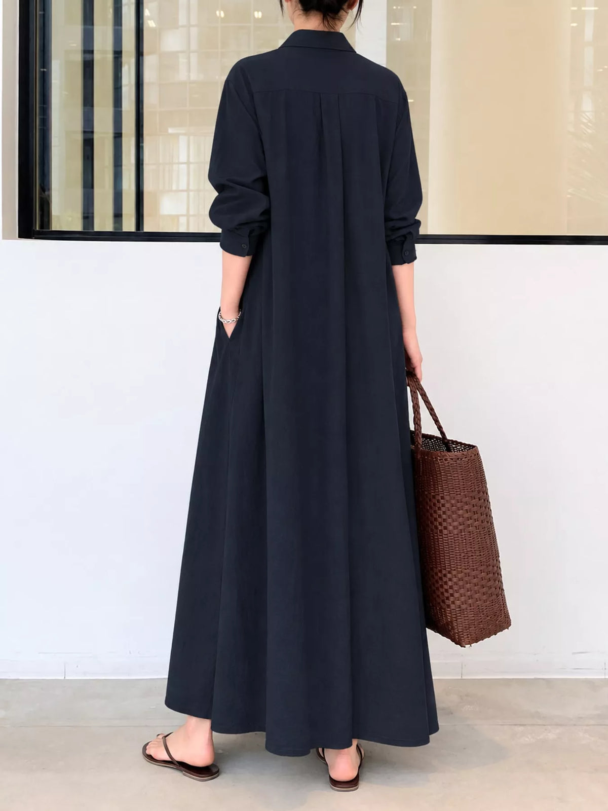 Black button-front maxi shirt dress back view, long sleeves and full skirt