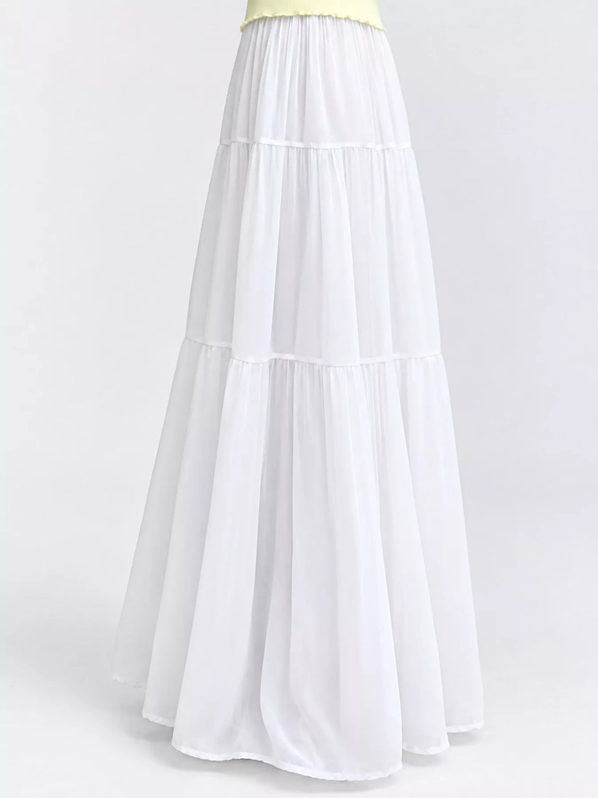 White tiered pleated maxi skirt with elastic waistband and tiered ruffle layers