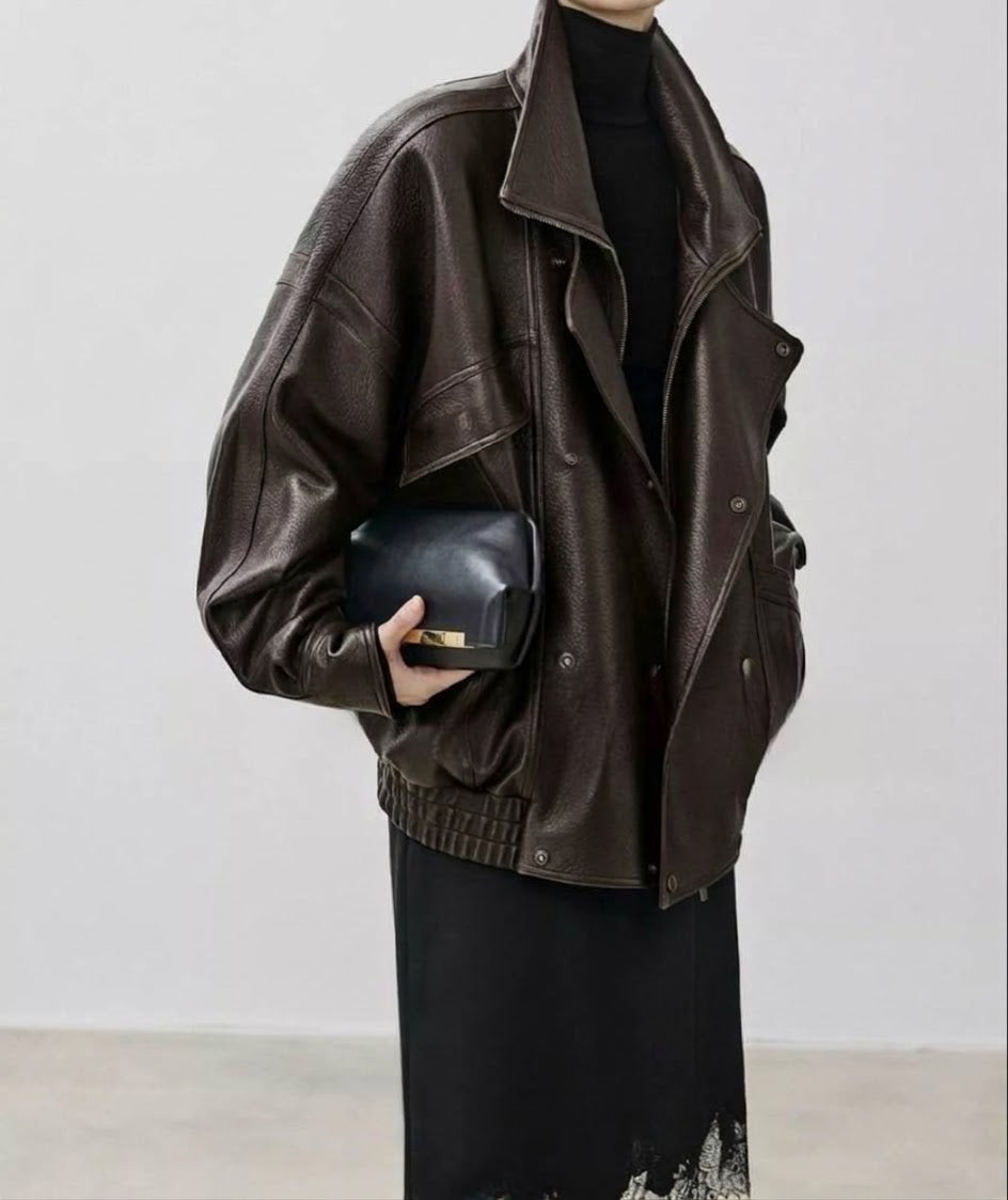Dark brown leather down jacket with stand collar, snap flap pocket, ribbed hem