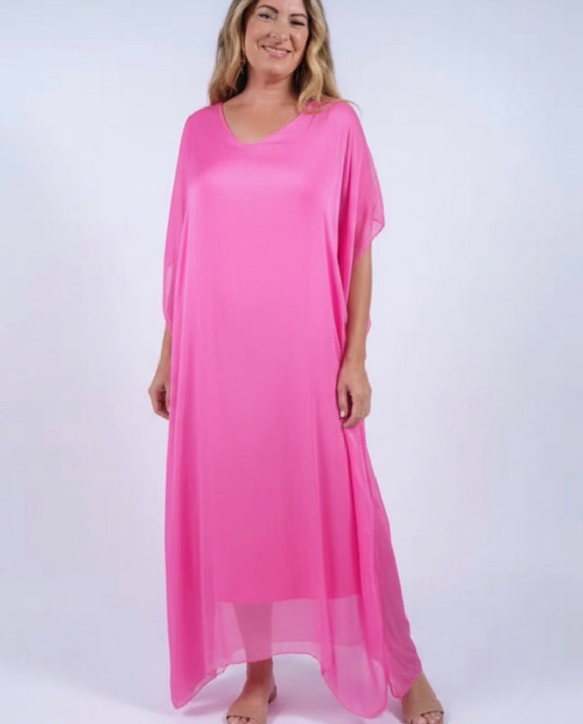 Pink silk kaftan dress with V-neck, loose drape, and short dolman sleeves