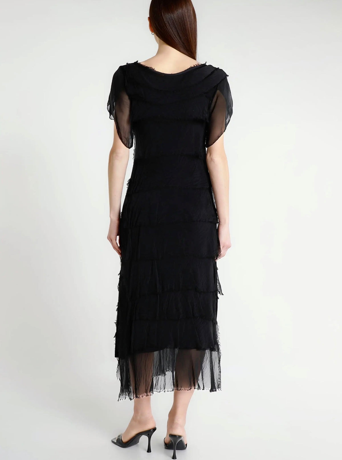 Black silk ruffle tiered short-sleeve dress with layered fringe, back view