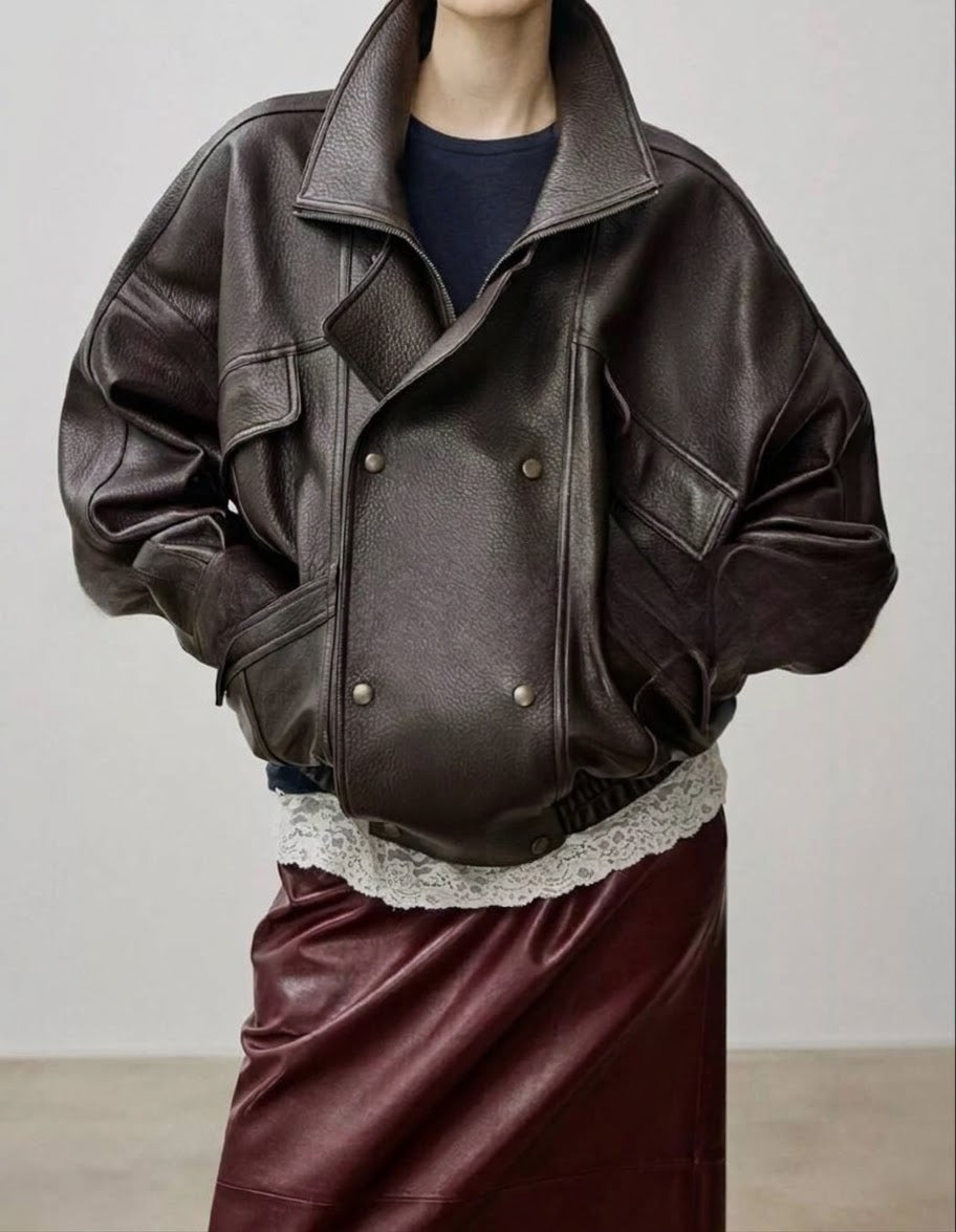 Dark brown leather down jacket with stand collar, flap pockets, and double-breasted snap front