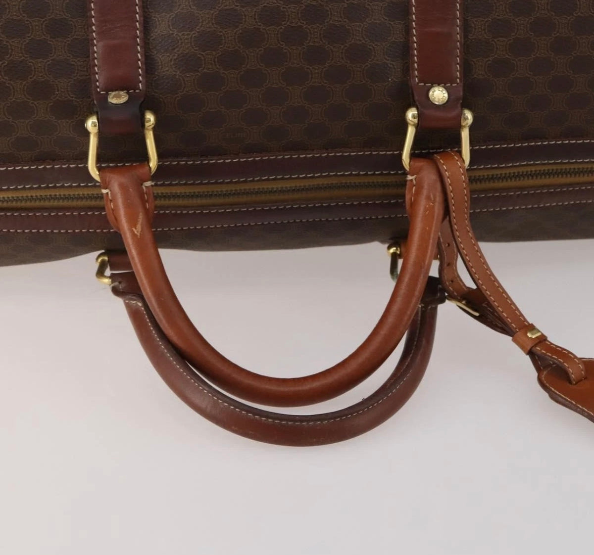 CELINE Macadam canvas Boston bag close-up of leather handles and gold-tone fittings