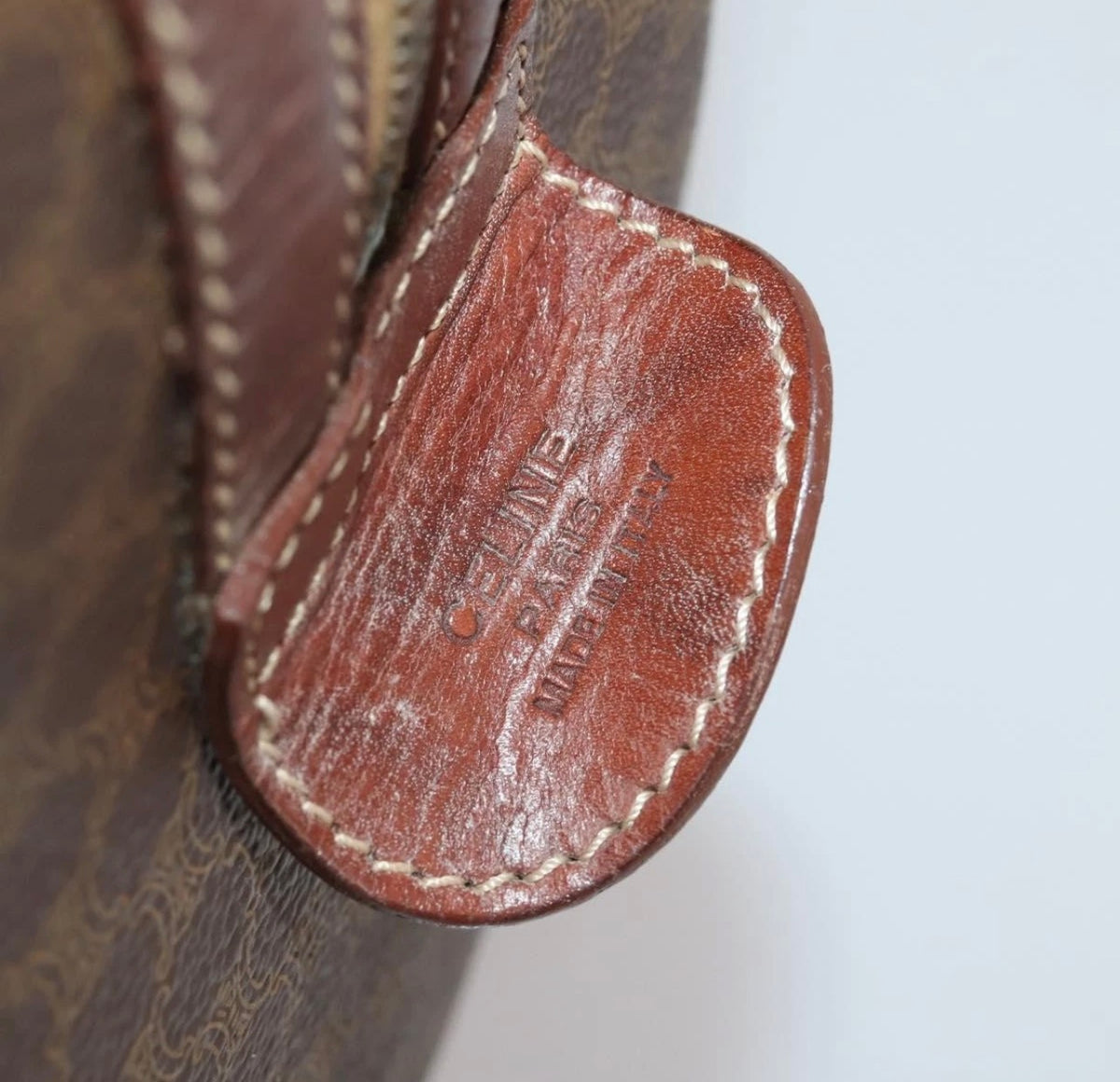 CELINE Macadam canvas Boston bag close-up of stitched leather tag embossed CELINE