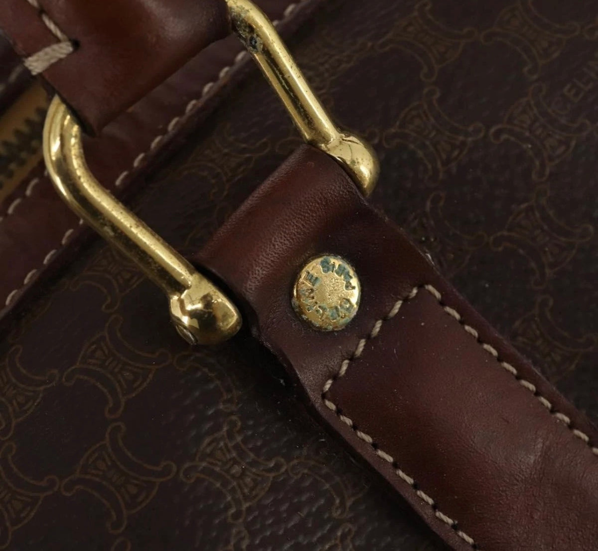 CELINE Macadam Boston bag close-up of leather handle fittings and patterned canvas