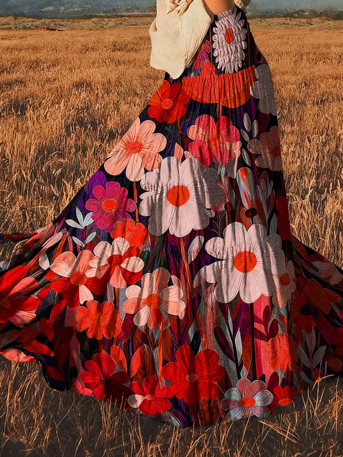 High-waisted maxi skirt with red, pink, and white flower print and flared hem