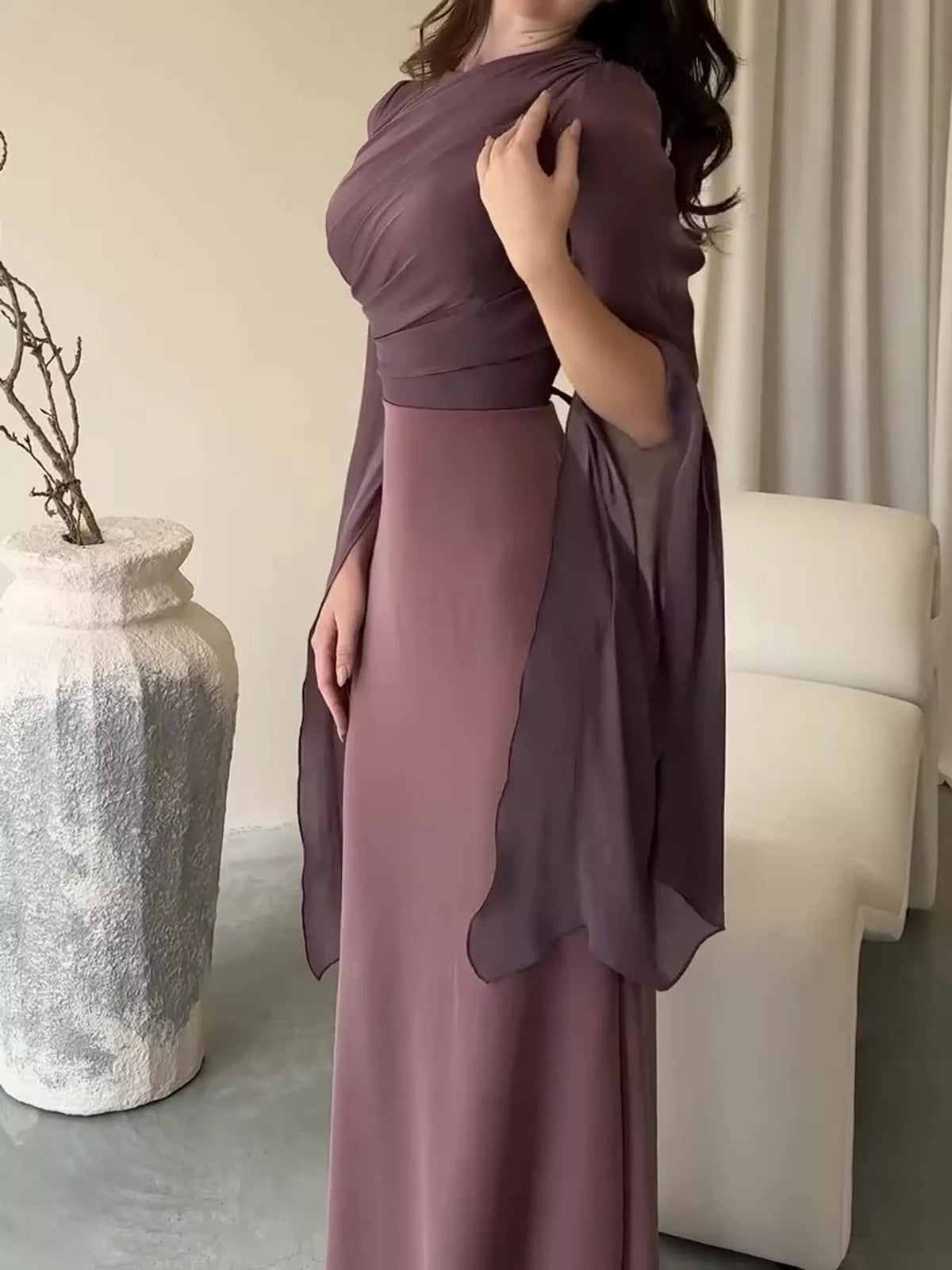 Mauve maxi dress with a ruched bodice, fitted waist and sheer flared sleeves