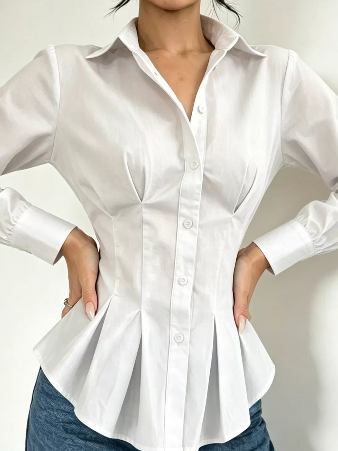 White button-down peplum blouse with fitted waist, gathered peplum hem, front view
