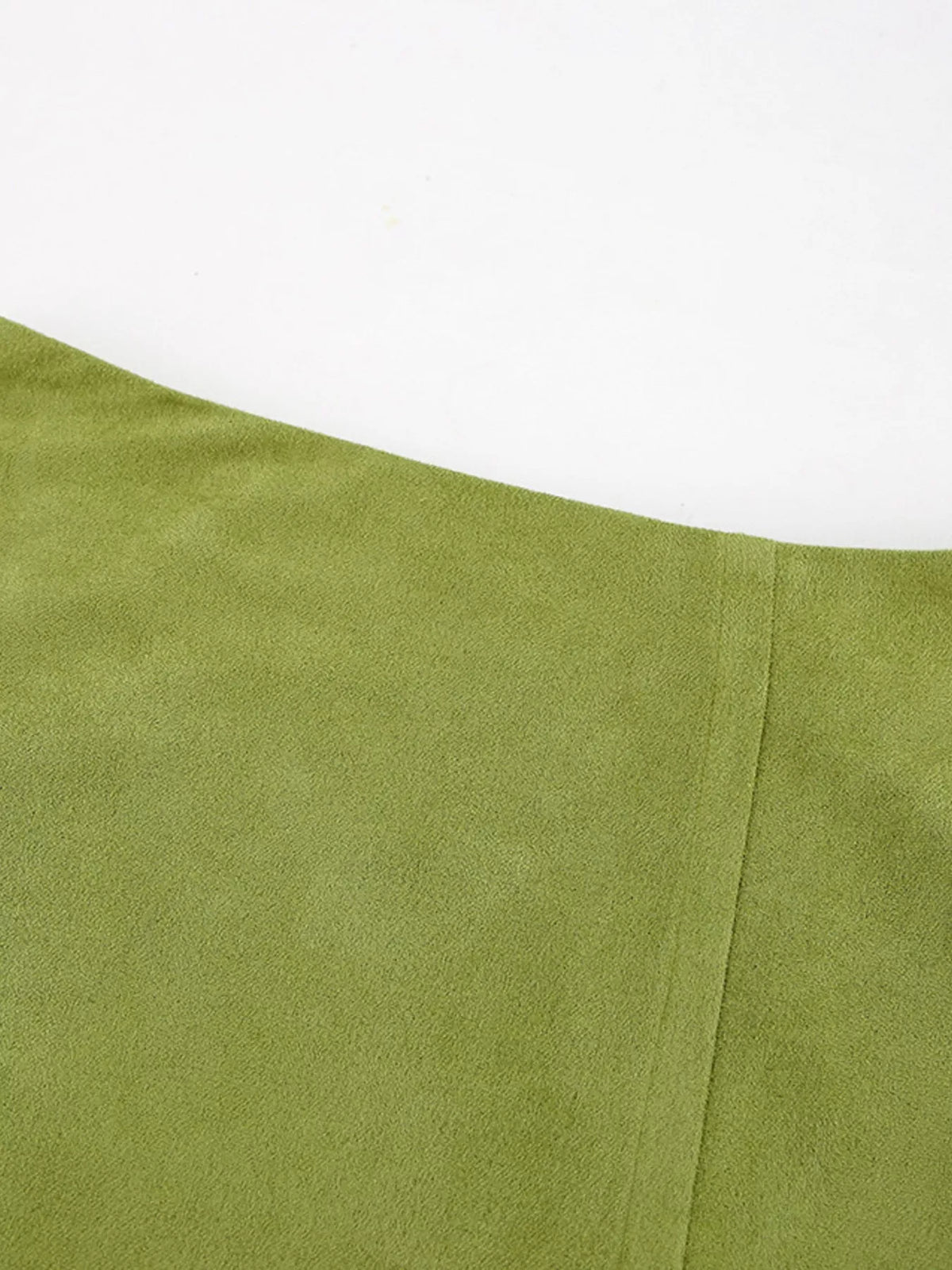 Matcha green skirt close-up showing the smooth fabric and a vertical seam.