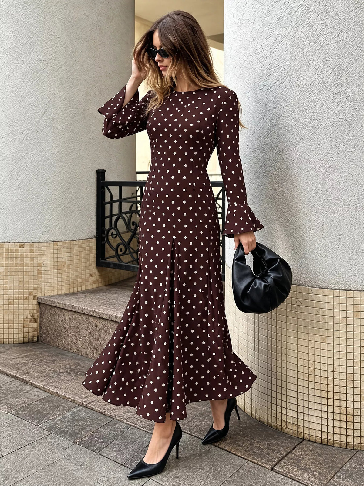 Coffee brown polka dot maxi dress with long bell sleeves and flared midi-to-maxi hem