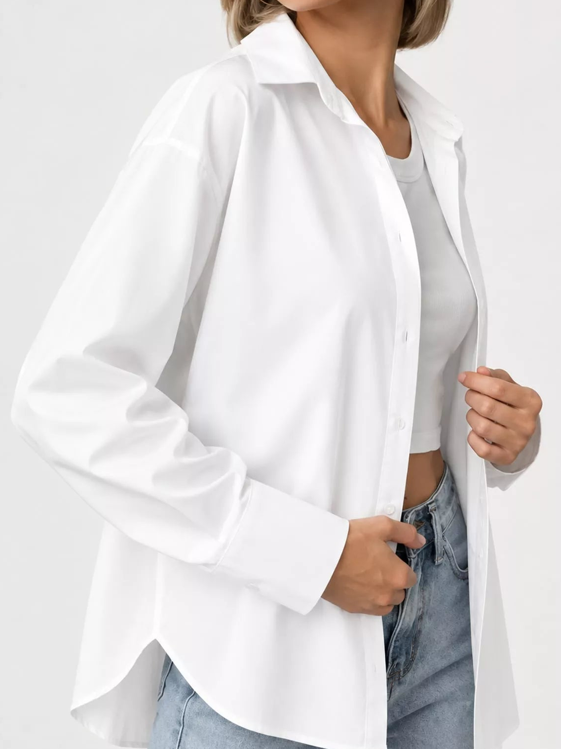 White button-up long sleeve shirt with pointed collar and front button placket