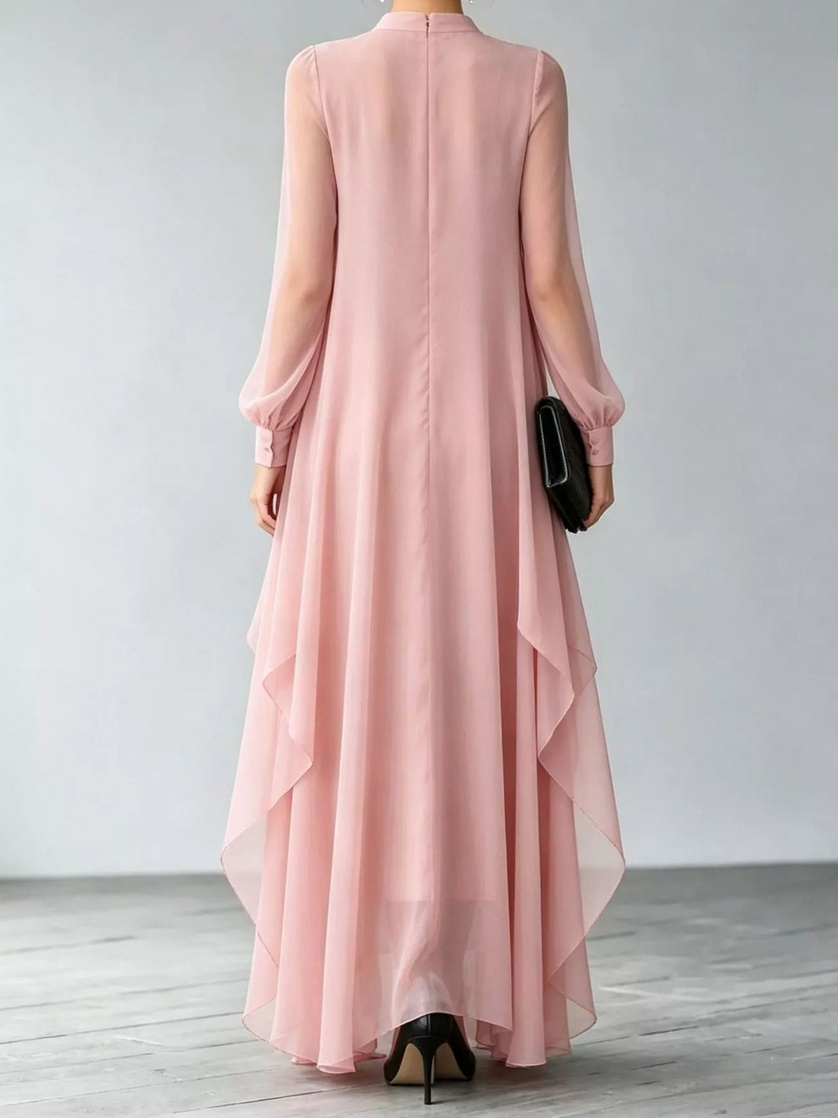 Back view of pink chiffon maxi dress with sheer sleeves and layered hem