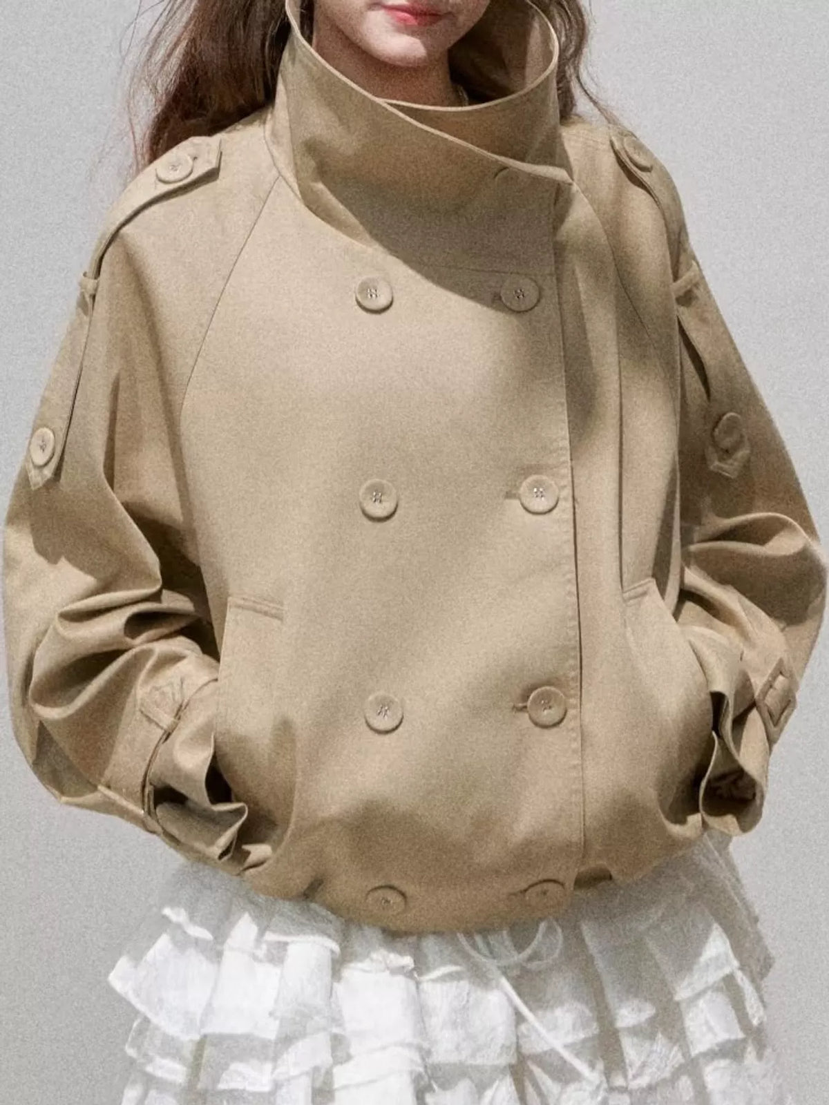Khaki double-breasted cropped trench jacket with stand collar, buttons, flap pockets