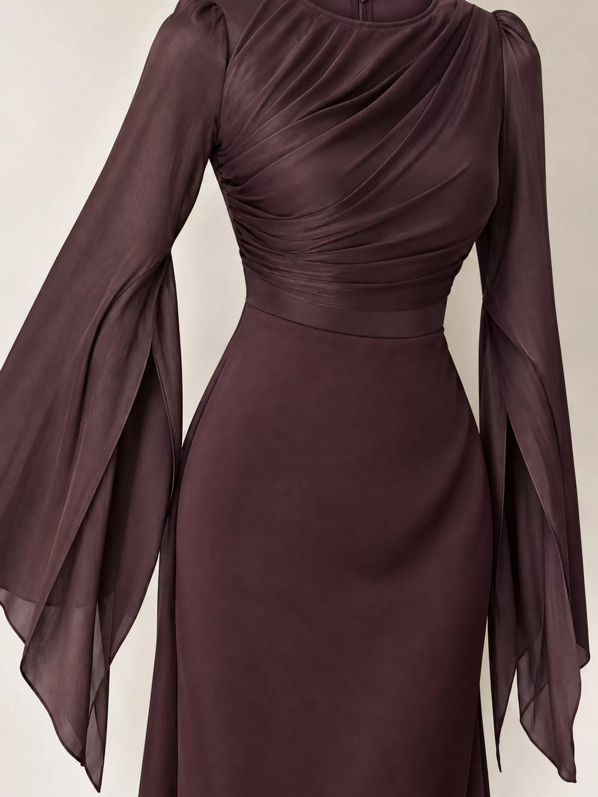 Burgundy maxi dress with a ruched bodice, fitted waist, and sheer flare sleeves
