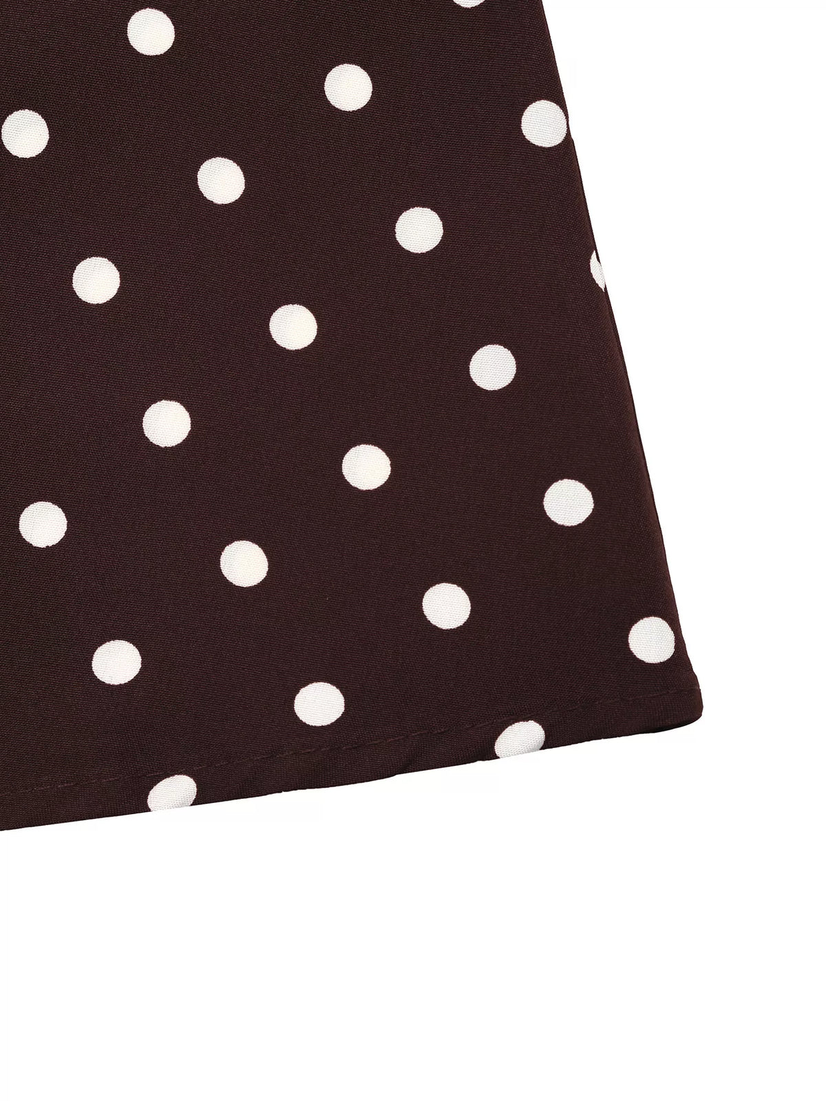 Close-up fabric view of coffee brown with white polka dots
