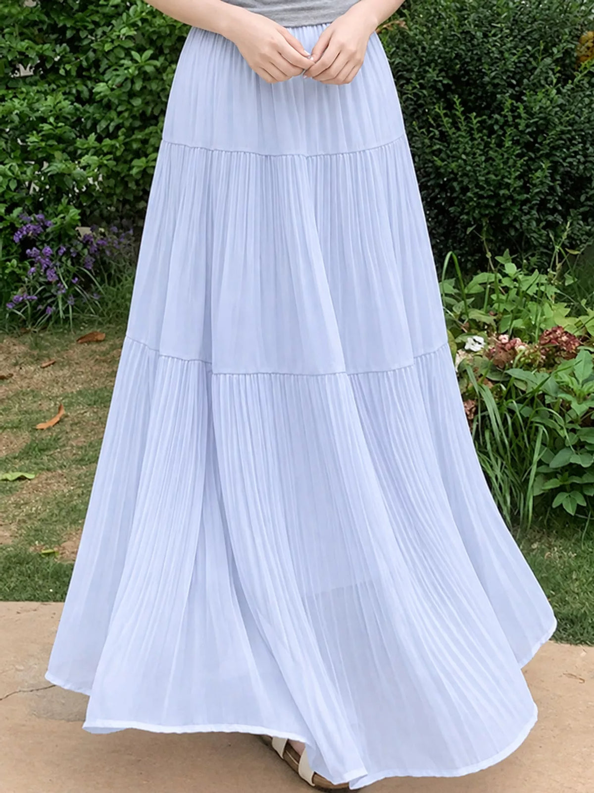 Light blue tiered pleated maxi skirt with elastic waistband and tiered skirt bands