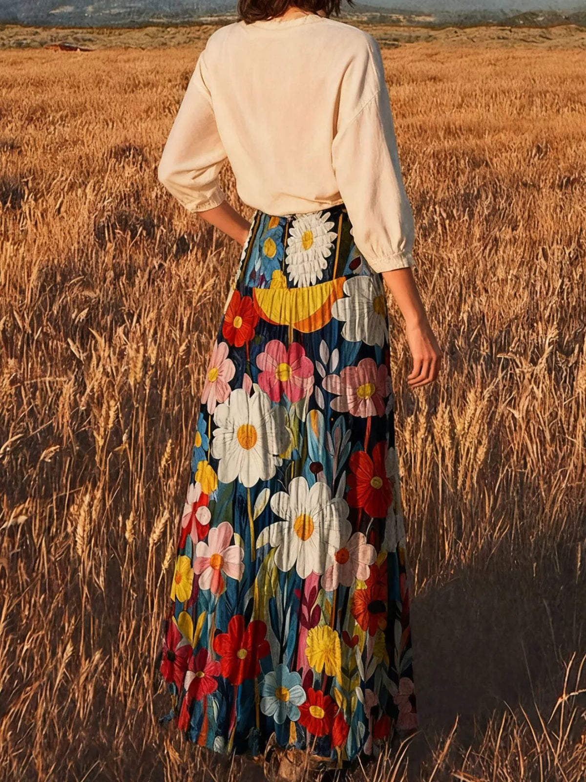 High-waisted maxi skirt with multicolor floral print and gathered tiers