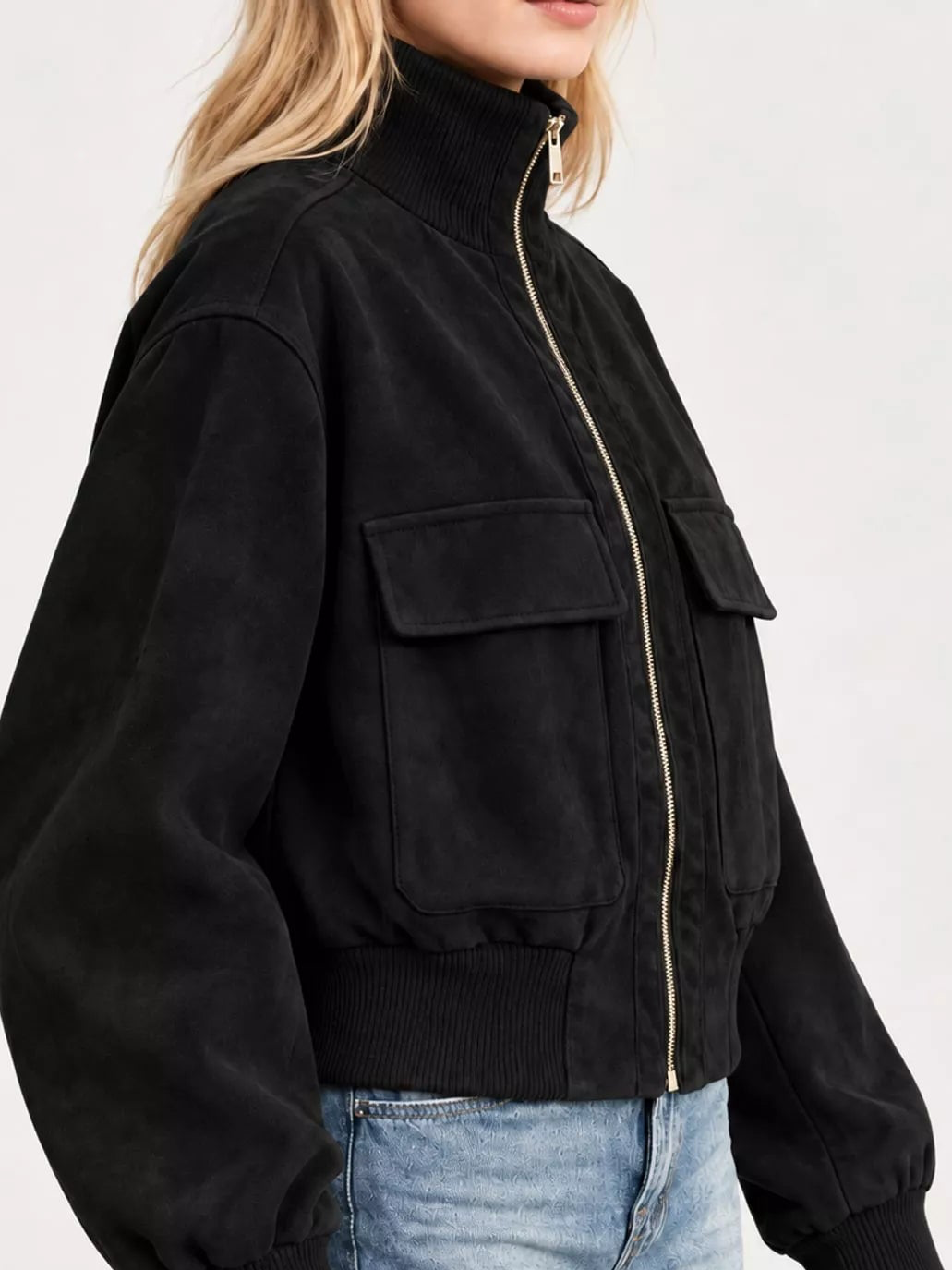 Black zip-up long-sleeve jacket with chest flap pockets and ribbed knit cuffs