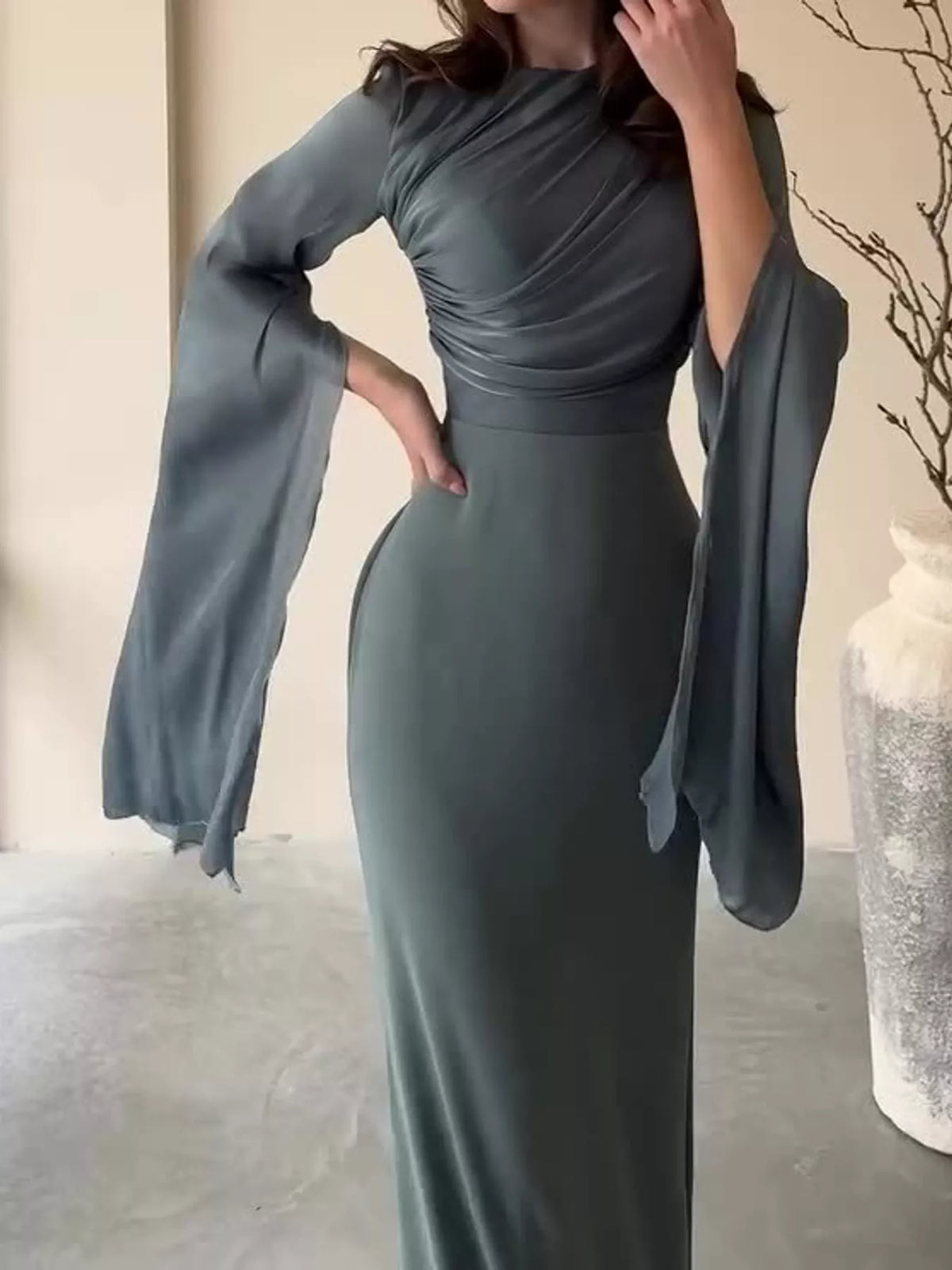 Dark gray maxi dress with a ruched top and wide sheer sleeves