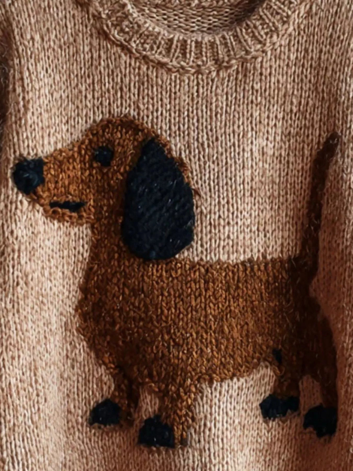 White dropped-shoulder knit sweater with dachshund intarsia front detail