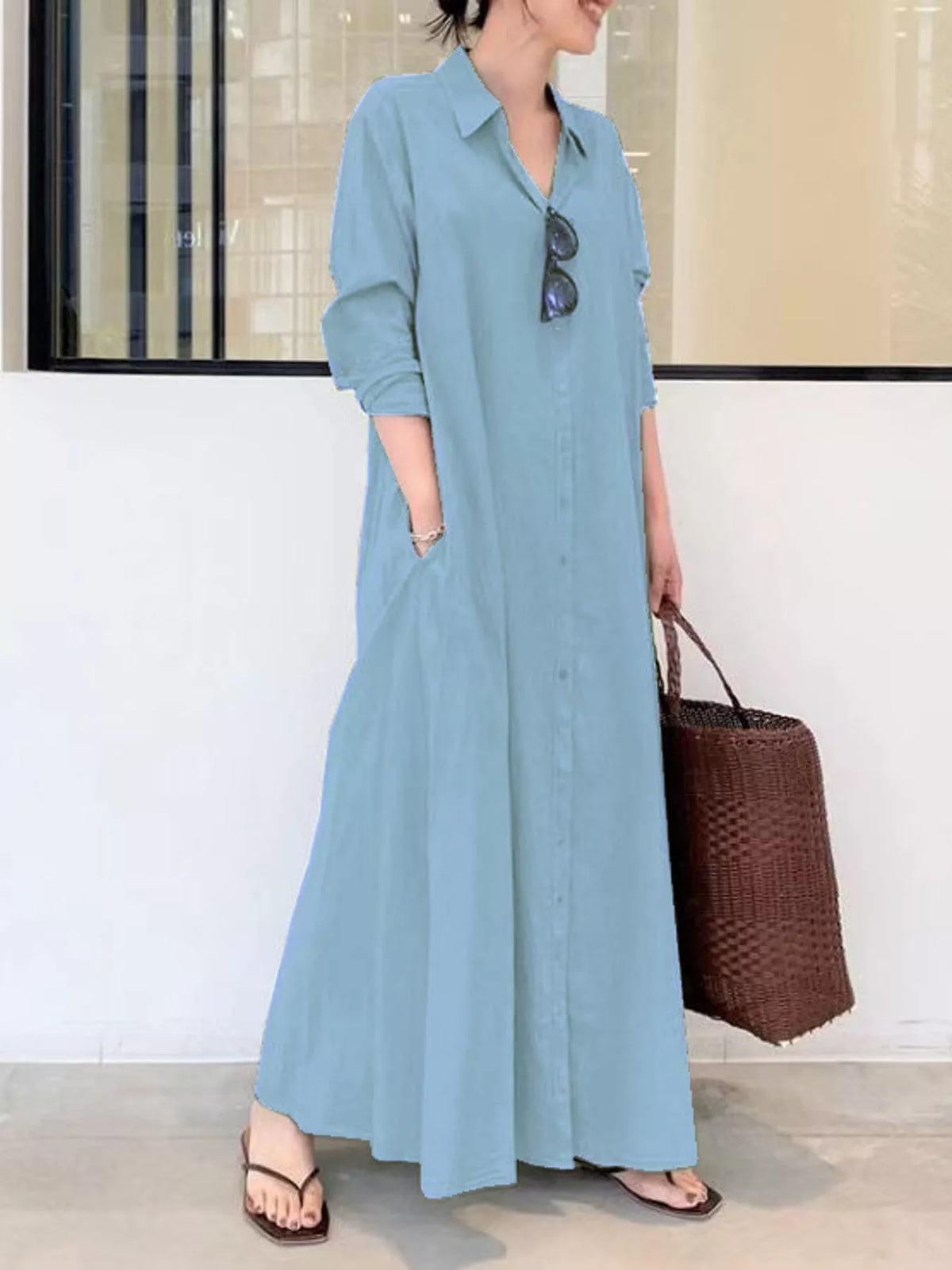 Light blue button-front long-sleeve maxi shirt dress with V-neck collar and gathered skirt