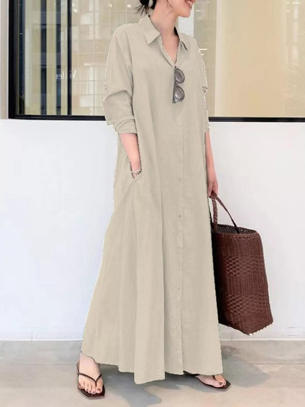 Light beige button-front long sleeve maxi shirt dress with V-neck and side pockets