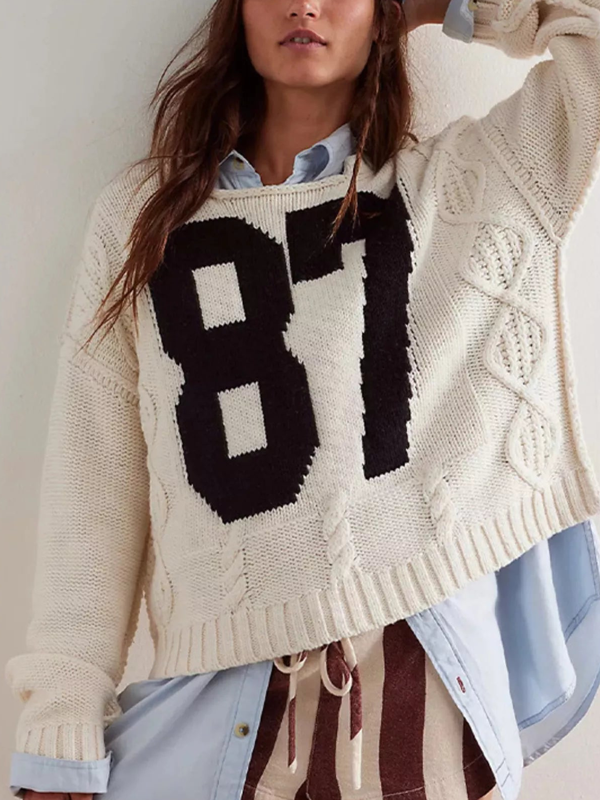 Off-white cable-knit sweater with oversized black 87 number graphic at front
